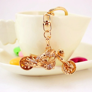 Creative gold motorcycle keychain with sparkling rhinestones and skull charm for men