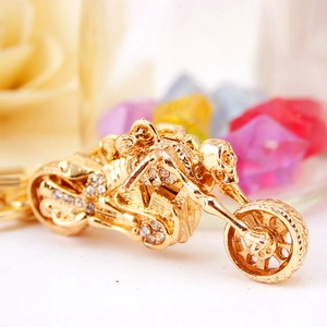 Rhinestone motorcycle keychain with skull rider in gold-tone alloy for men