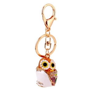 Colorful owl keychain with white enamel body and sparkling crystal accents on gold plating