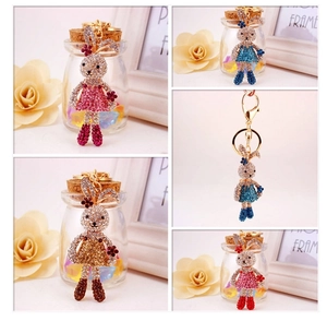 Detailed macro view of cute cartoon bunny keychains with sparkling inlaid rhinestones