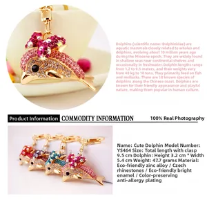 Detail of colorful rhinestone dolphin keychains in pink, blue, purple, and red crystal