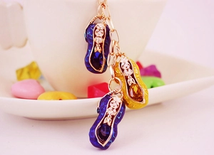 Exquisite peanut charms on a gold keychain with blue and yellow oil-dripped enamel finish