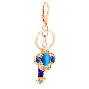Golden flower keychain with blue gemstone and foldable phone holder function