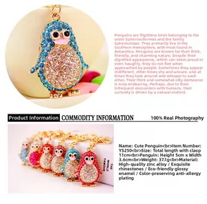 Close-up of rhinestone penguin keychain featuring vibrant crystals and polished alloy finish