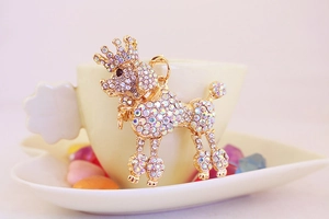 Detailed close-up of a luxury crown poodle keychain with shimmering AB rhinestones