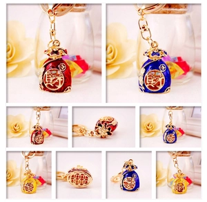 Detail of Chinese style lucky bag keychain with colorful enamel and sparkling rhinestones