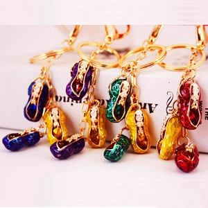 Peanut-shaped enamel keychains with rhinestones and lobster clasps in five vibrant colors