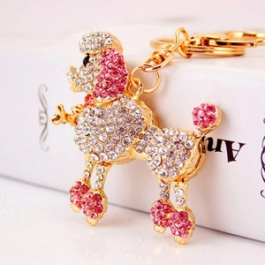Sparkling poodle keychain with pink and white crystals on a gold metal base