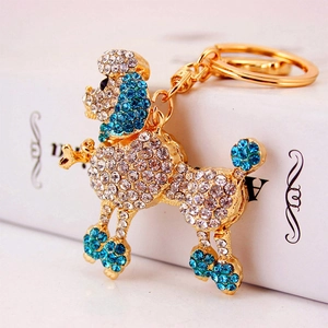 Sparkling Poodle keychain with blue and white crystals on a gold-plated metal base