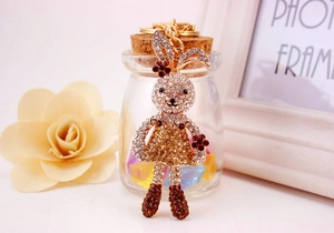 Detail of cute rhinestone long-legged bunny keychain with golden ring and lobster clasp