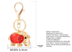 Detailed view of rhinestone elephant keychain with red crystal accents and lobster clasp