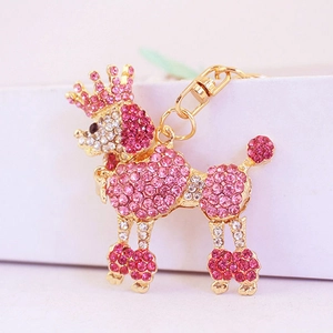 Pink rhinestone poodle keychain featuring a golden crown and sparkling crystal charm