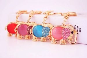 Detail of cute elephant keychains with colorful rhinestones in red, blue, pink and purple