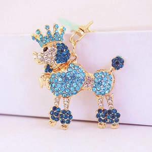 Golden crown poodle keychain accessory with shimmering blue and clear crystals