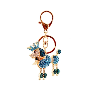 Porte-clés caniche étincelant avec strass bleus et détail de couronne dorée