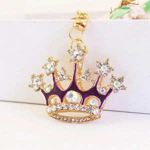 Sparkling crystal crown keychain with purple enamel and star charm in gold finish