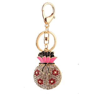 Sparkling lucky money bag keychain with red and white rhinestones on golden alloy chain