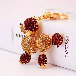 Sparkly poodle keychain with colorful rhinestones on a gold metal dog pendant
