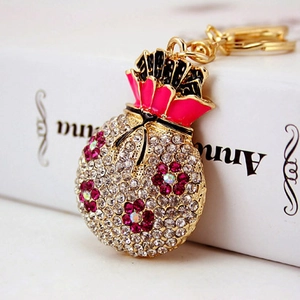 Sparkling lucky money bag keychain with red crystal flower and pink enamel inlay