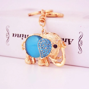 Cute golden elephant keychain with sparkling blue rhinestones and crystal charm