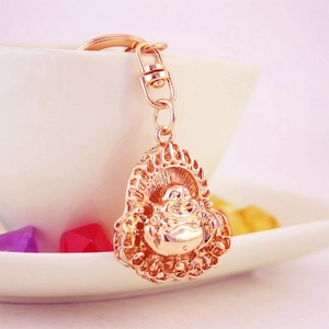 Golden Maitreya Buddha keychain with intricate filigree details and lobster clasp