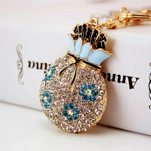 Sparkling crystal flower money bag keychain pendant with blue enamel in gold finish