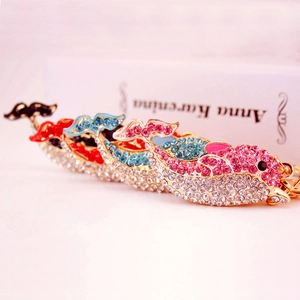 Sparkling rhinestone dolphin keychains in gold metal finish for bags and accessories