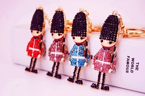 Detail of colorful crystal-studded Royal Guard keychains with gold-tone hardware