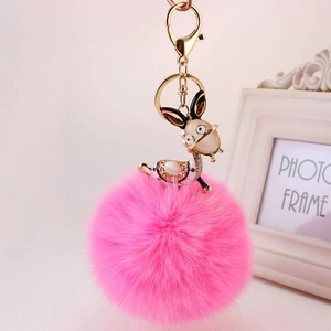 Cute pink faux rabbit fur keychain with gold cartoon charm and sparkling rhinestones