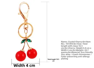 Detail view of crystal red cherry keychain with dimensions 10.5cm and gold metal clasp