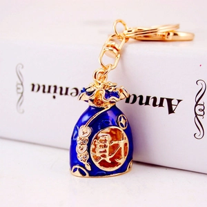 Blue enamel fortune bag keychain with gold plating and rhinestones for women