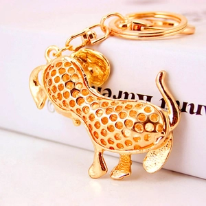 Creative Dalmatian dog keychain with hollow gold alloy design and sparkling rhinestones