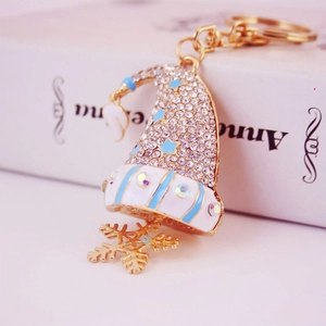 Porte-clés bonnet de Noël scintillant avec étoiles bleues et pendentif flocon doré