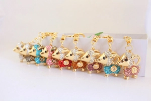 Close-up of cute sheep keychains with colorful rhinestones in multiple vibrant finishes