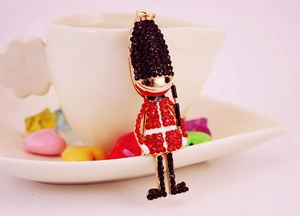 Detailed close-up of crystal Royal Guard keychain with sparkling red and black rhinestones