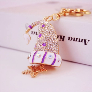 Porte-clés bonnet de Noël violet scintillant avec flocon doré et strass brillants