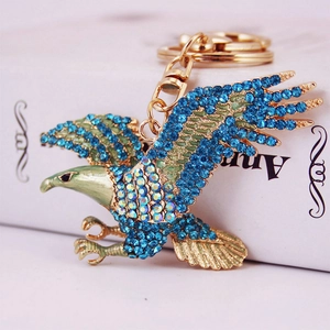 Porte-clés aigle étincelant avec strass bleus et alliage doré pour sacs et voitures