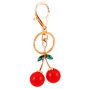 Sparkling crystal red cherry keychain with gold metal hook and green leaf accents