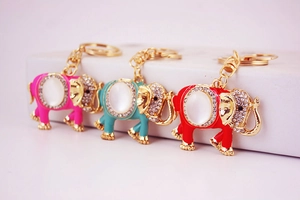 Détails de porte-clés éléphant avec émail coloré œil de chat et cristaux brillants