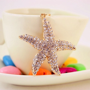 Sparkling starfish keychain with white rhinestones on a gold base for women bag accessories