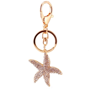 Sparkling starfish keychain with white rhinestones and golden metal alloy finish