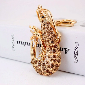 Luxury lobster keychain with sparkling brown rhinestones on a gold-plated alloy body