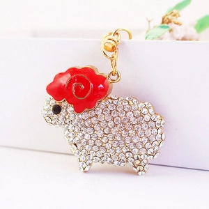 Sparkling crystal sheep keychain with gold metal plating and red enamel horns