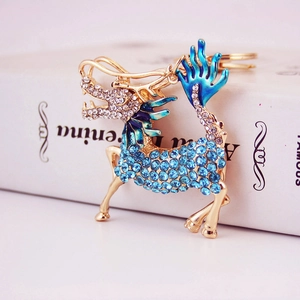Golden Kirin mythical beast keychain with blue crystals and teal enamel work