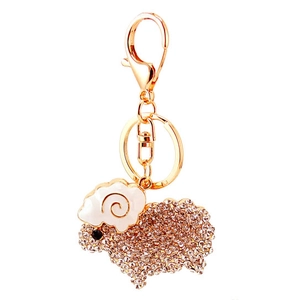 Cute sheep keychain with sparkling rhinestones and white enamel in golden alloy finish