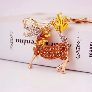 Chinese mythical Kirin keychain with orange rhinestones and golden metal finish
