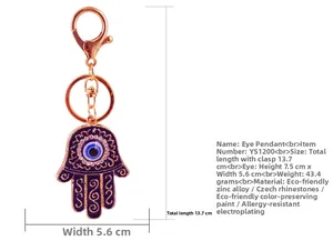 Detailed size specifications for the rose gold Hamsa Hand keychain with blue evil eye