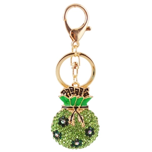 Porte-clés sac porte-bonheur avec strass verts et fermoir mousqueton doré élégant