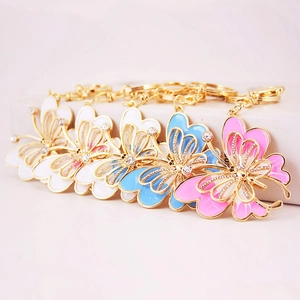 Porte-clés papillon colorés avec strass en émail blanc, bleu et rose élégant