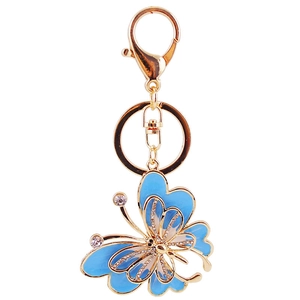 Porte-clés papillon doré avec émail bleu clair et strass blancs étincelants